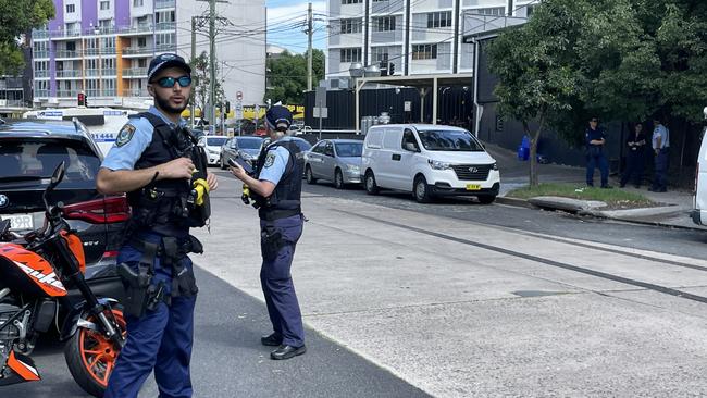 Police officers at the scene of the stabbing incident at Park Rd, Homebush. Picture: Odessa Blain