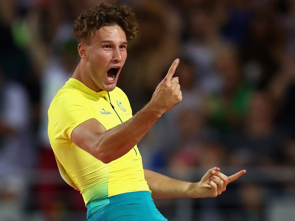 Australia’s Kurtis Marschall celebrates winning gold in the pole vault on Thursday night.