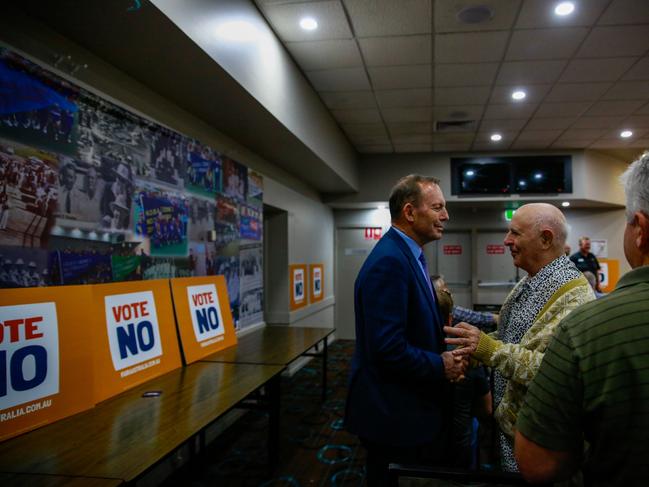 NEWCASTLE, AUSTRALIA - OCTOBER 05: Former Australian prime minister Tony Abbott talks wit an attendee at 'Tony Abbot - Vote No Hunter Region' event at Raymond Terrace Bowling Club on October 05, 2023 in Newcastle, Australia. A referendum for Australians to decide on an indigenous voice to parliament will be held on October 14, 2023 and compels all Australians to vote by law. Early voting began on Oct. 2, with voting getting underway in rural and regional Australia as well.  (Photo by Roni Bintang/Getty Images)