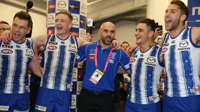 Shaw sings the Kangaroos song with his players after his first win as interim coach. Picture: Michael Klein.