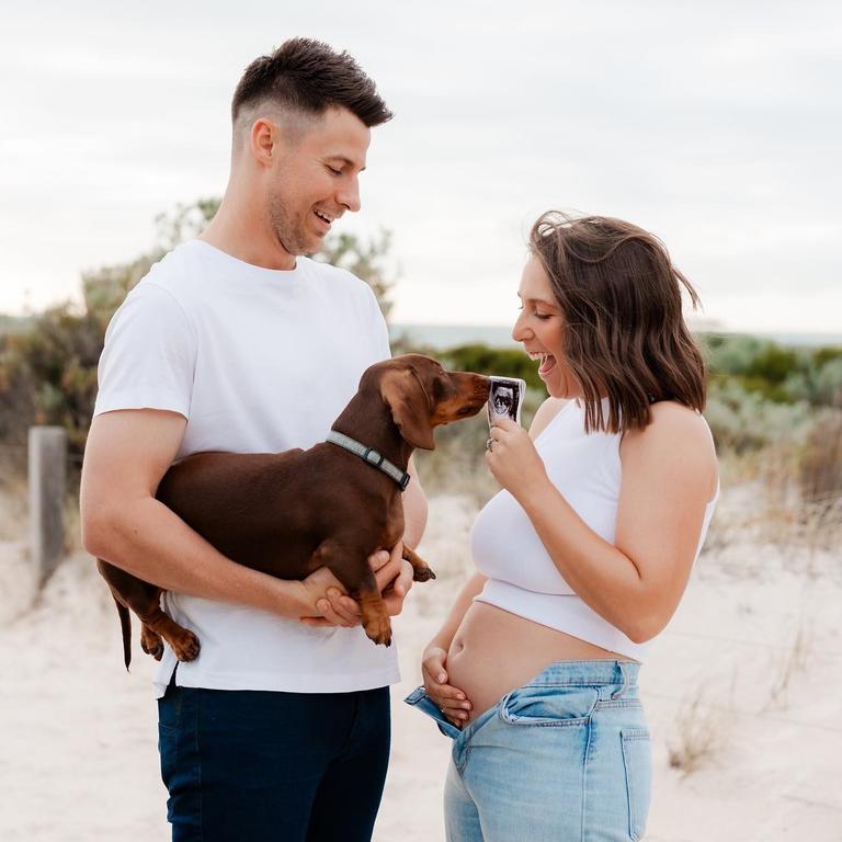 Laura and Max Sharrad, with dog Alfie, have announced they are expecting a baby. Picture: Mish at Olive Leaf Studio