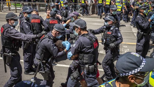 Riot police arrest protesters. Picture: Jake Nowakowski