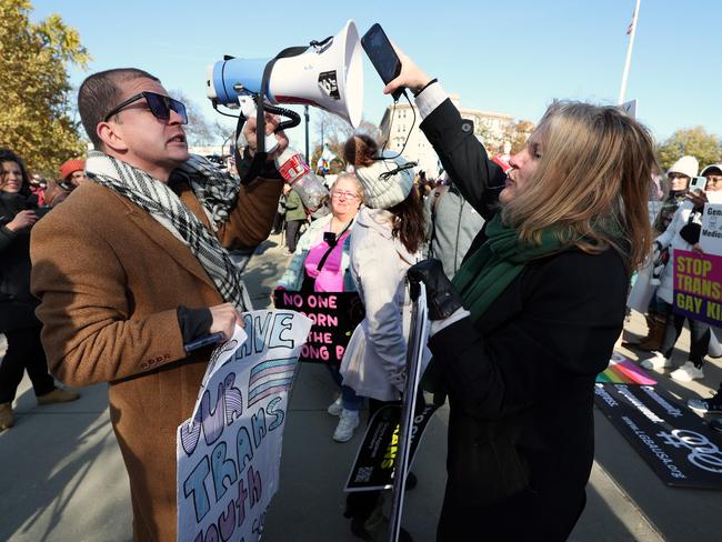 WASHINGTON, DC - DECEMBER 04: Transgender rights supporters and opponent argue with each other at a rally outside of the U.S. Supreme Court as the high court hears arguments in a case on transgender health rights on December 04, 2024 in Washington, DC. The Supreme Court is hearing arguments in US v. Skrmetti, a case about Tennessee's law banning gender-affirming care for minors and if it violates the Constitutionâs equal protection guarantee.   Kevin Dietsch/Getty Images/AFP (Photo by Kevin Dietsch / GETTY IMAGES NORTH AMERICA / Getty Images via AFP)