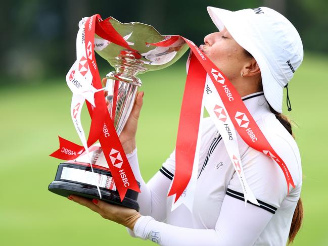 Hannah Green kisses the trophy after winning the HSBC Women's World Championship in Singapore. Picture: Getty Images