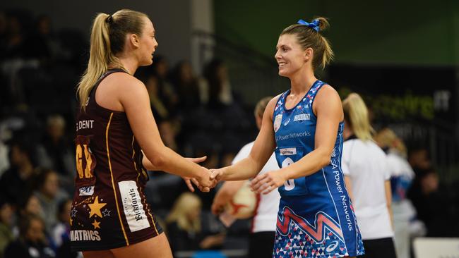 Matrics' Georgia Dent and Contax's Imogen Abernethy shake hands the 2022 Netball SA Premier League season. The two clubs will meet in the grand final once again on Friday night. Picture: Netball SA