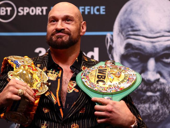 (FILES) In this file photo taken on April 20, 2022 World Boxing Council (WBC) heavyweight title holder Britain's Tyson Fury takes part in an pre-fight press conference at Wembley Stadium in west London. - WBC heavyweight champion Tyson Fury said he is retiring from boxing on his 34th birthday on August 12, 2022, having previously performed a number of U-turns over his future in the sport. 