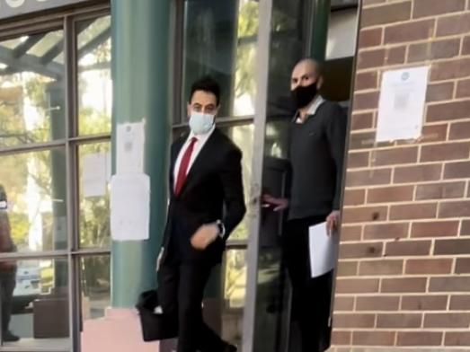 Emre Atmali (right, with black face mask), leaves Burwood Local Court alongside lawyer Chaddy Mardini.