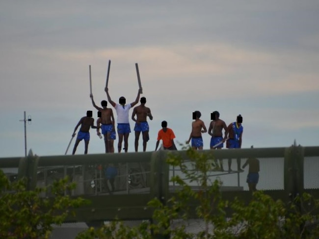 Youths rioting on top of a building at Cleveland Youth Detention Centre in 2016. Picture: DOMANII CAMERON