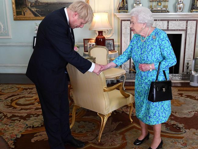 Britain's Queen Elizabeth II welcomes newly elected leader of the Conservative party, Boris Johnson during an audience in Buckingham Palace, London, last year. Picture: AFP