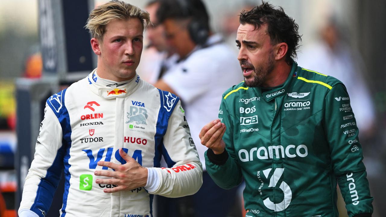 AUSTIN, TEXAS - OCTOBER 19: 16th placed Liam Lawson of New Zealand and Visa Cash App RB and 18th placed Fernando Alonso of Spain and Aston Martin F1 Team talk in parc ferme during the Sprint ahead of the F1 Grand Prix of United States at Circuit of The Americas on October 19, 2024 in Austin, Texas. Rudy Carezzevoli/Getty Images/AFP (Photo by Rudy Carezzevoli / GETTY IMAGES NORTH AMERICA / Getty Images via AFP)