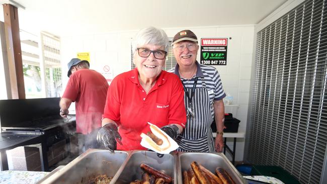 Daphne Selwood and Chris Davis serving up democracy sausages at the Varsity Lakes Community Centre polling booth. Picture by Richard Gosling