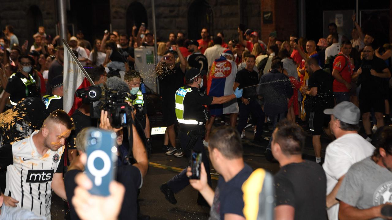 Fans were sprayed as they rushed to the car. Picture: AFP