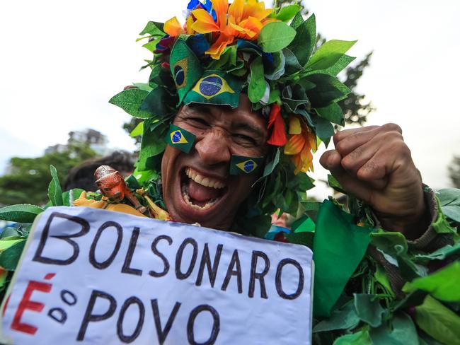 RIO DE JANEIRO, BRAZIL - OCTOBER 28: A supporter of far-right lawmaker and presidential candidate for the Social Liberal Party (PSL), Jair Bolsonaro, take part in a pro-Bolsonaro demonstration in Rio de Janeiro, Brazil, during the second round of the presidential elections on October 28, 2018 in Rio de Janeiro, Brazil. Bolsonaro is running against Workers Party candidate Fernando Haddad to replace outgoing President Michel Temer. (Photo by Buda Mendes/Getty Images) ***BESTPIX***