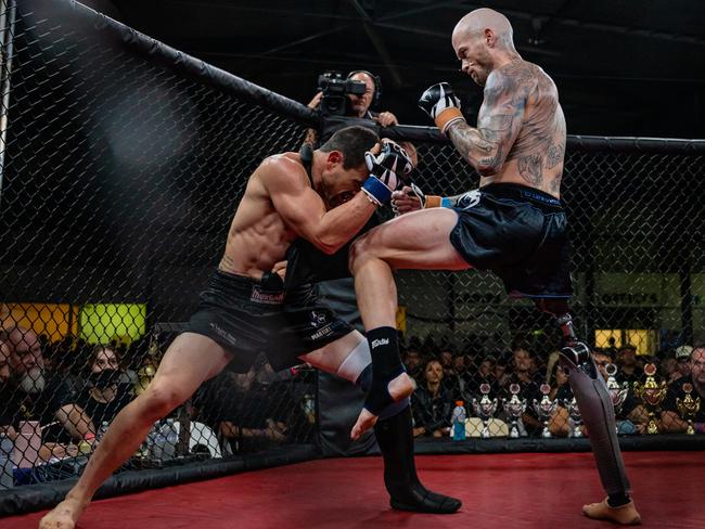 Amputee fighters Glenn Dickson and Buck Cooper square off in the cage during the Explosive Fight Promotions fight night on Saturday June 1 in an Australian first. Picture: Emily Barker