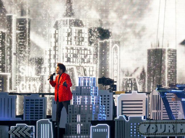 The Weeknd pictured on stage at the Super Bowl, which boasts a $US 5.6 million price tag per commercial. Picture: Getty Images