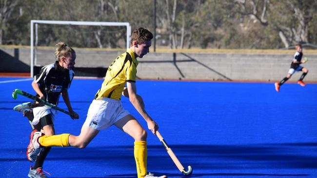 Josh Hagenbach takes the ball forward for Warwick Hotel Yellow in the Warwick Hockey Association W1 Junior grand final.