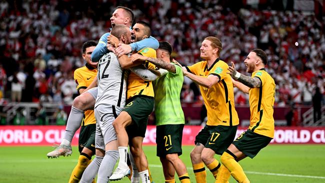 Australian players go berserk. Photo by Joe Allison/Getty Images.