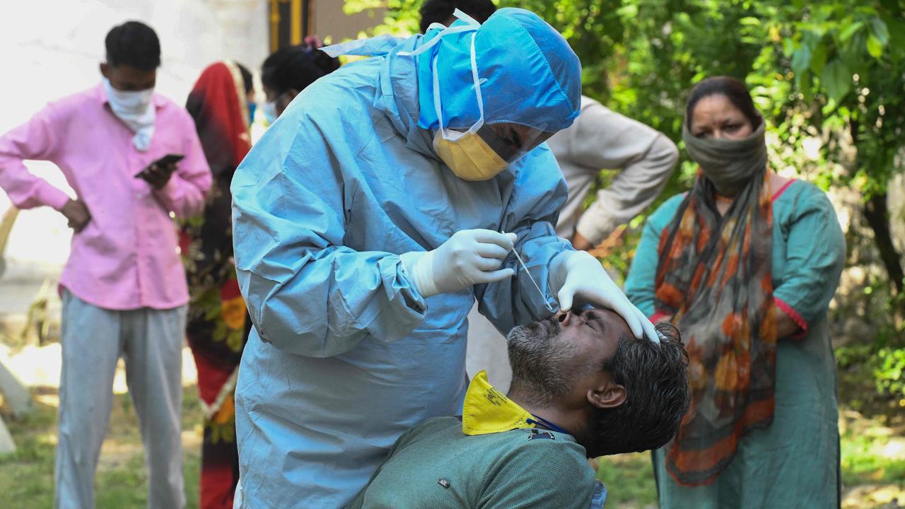 A doctor takes a sample from man for a COVID-19 test during a government-imposed nationwide lockdown in India. Picture: AFP