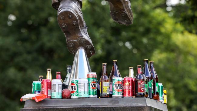 Beer bottles left as a tribute to Shane Warne at the cricket legend’s MCG statue. Picture: Ian Currie