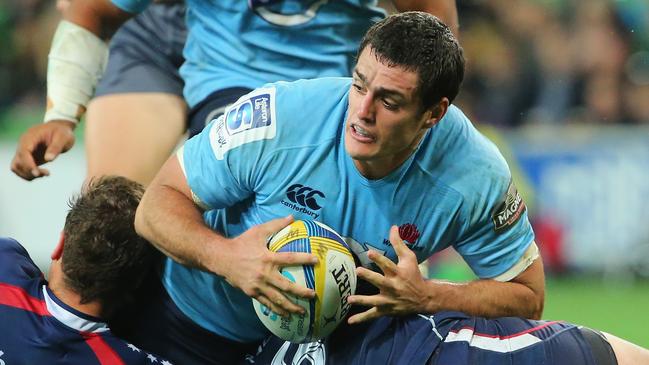 MELBOURNE, AUSTRALIA - MAY 23: Dave Dennis of the Waratahs is tackled during the round 15 Super Rugby match between the Rebels and the Waratahs at AAMI Park on May 23, 2014 in Melbourne, Australia. (Photo by Scott Barbour/Getty Images)