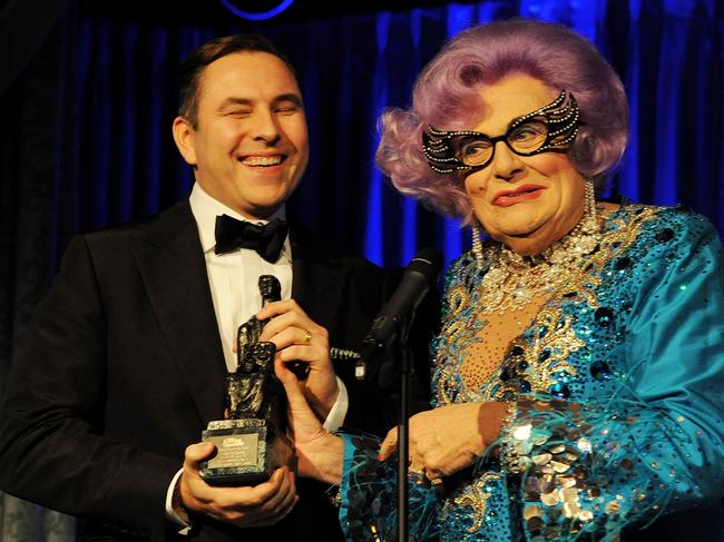 LONDON, ENGLAND - NOVEMBER 17:  David Walliams (L) accepts the Award For Comedy from Dame Edna Everage at the 59th London Evening Standard Theatre Awards at The Savoy Hotel on November 17, 2013 in London, England.  (Photo by David M. Benett/Getty Images)