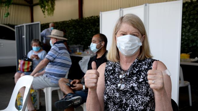 Jenny Pyke, from The Hat Project, gives the thumbs-up to her Covid booster shot. Picture: Andrew Henshaw