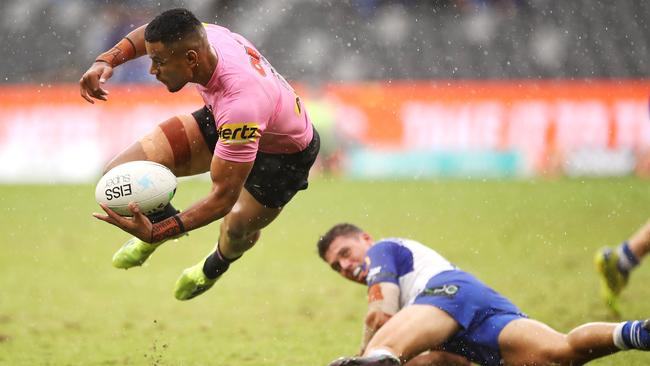 Stephen Crichton slips a pass away in the wet at Bankwest Stadium. Picture: Getty Images