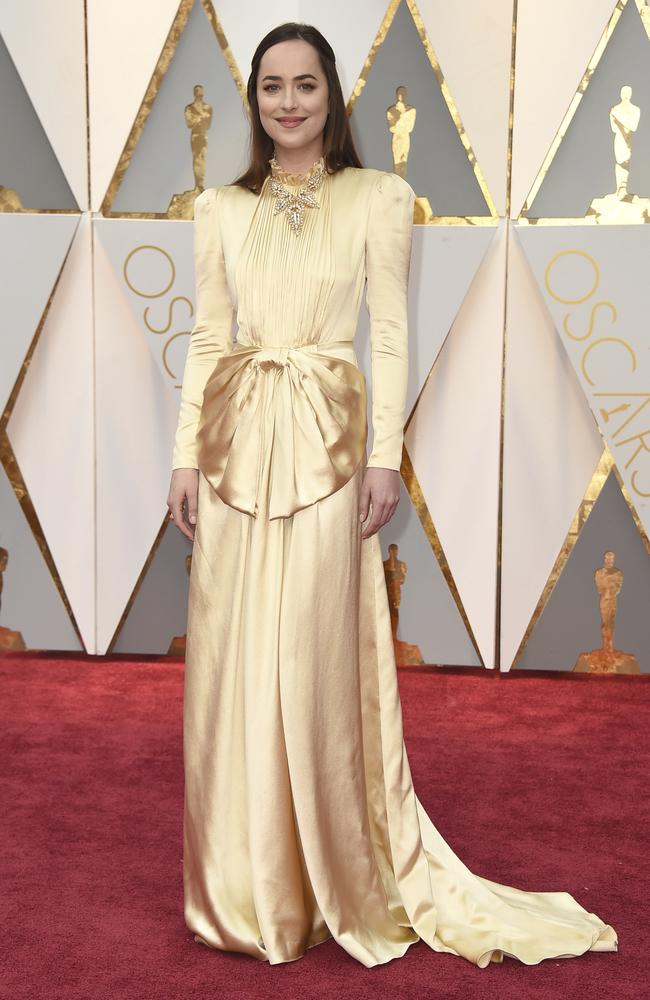 Fifty Shades Darker actor Dakota Johnson also got the gold memo (this time, in Gucci). Picture: AP