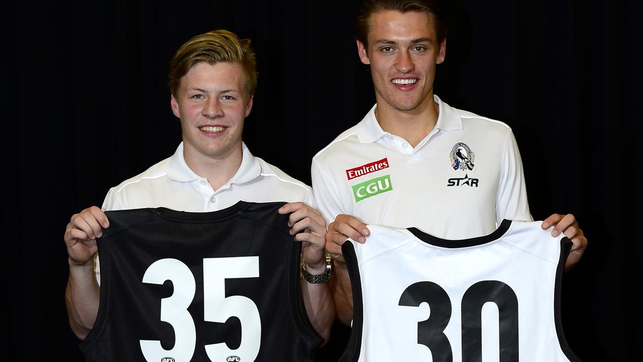 Jordan De Goey and Darcy Moore after being picked up by the Magpies. Picture: Stephen Harman