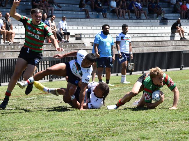 Haizyn Mellars (left) of the Rabbitohs celebrates a Drew Williams try. Picture: Sean Teuma/NewsLocal