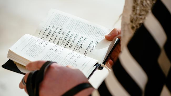 Religious Jewish believer reading the Torah and praying at Wailing Wall (Kotel) in Jerusalem, Israel. (Pic: Getty Images)