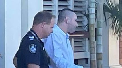 Kenneth James Hampton is escorted back to the watch house after being found guilty of assault occasioning bodily harm and grievous bodily harm.