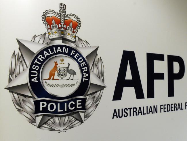 An Australian Federal Police logo is seen in Geelong, Friday, Oct 3, 2014. (AAP Image/Julian Smith) NO ARCHIVING