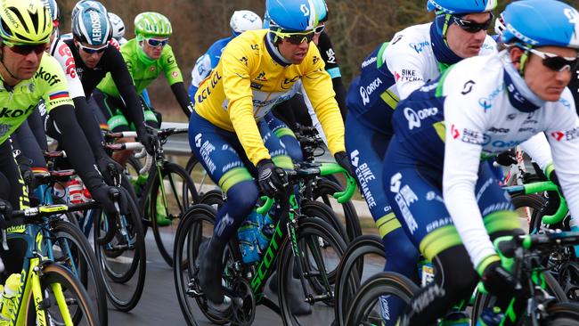 Australia's Michael Matthews rides in the pack wearing the overall leader's yellow jersey during the first stage of the 74th edition of the Paris-Nice cycling race between Conde-sur-Vesgre and Vendome on March 7, 2016. / AFP / KENZO TRIBOUILLARD