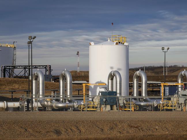 FILE - In this Nov. 6, 2015 file photo, a TransCanada's Keystone pipeline facility is seen in Hardisty, Alberta.  Opponents of the long-stalled Keystone XL oil pipeline say President Donald Trump acted illegally when he issued a new permit for the project to get around an earlier court ruling.  Attorneys for environmental groups asked U.S. District Judge Brian Morris Friday, April 5, 2019 to strike down the permit.  (Jeff McIntosh/The Canadian Press via AP, File)