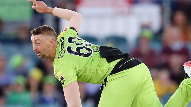 CANBERRA, AUSTRALIA - DECEMBER 14: Daniel Sams of the Thunder   bowls during the Big Bash League match between the Sydney Thunder and the Brisbane Heat at Manuka Oval, on December 14, 2020, in Canberra, Australia. (Photo by Brendon Thorne/Getty Images)