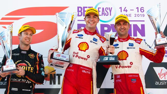 Holden driver Dave Reynolds (left) after coming third in Darwin earlier this month behind Ford drivers Scott McLaughlin (centre) and Fabian Coulthard (right). Picture: Getty Images