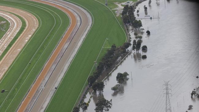 The swollen Maribyrnong River in Flemington. Picture: David Caird