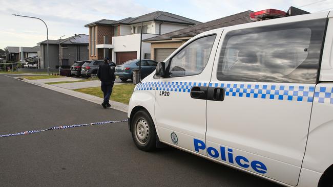 Police on the scene at a home in Carnes Hill. Picture: NewsWire