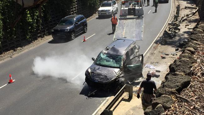 A woman has been rescued after her car rolled and caught on fire in Heathmont. Picture: John Williams