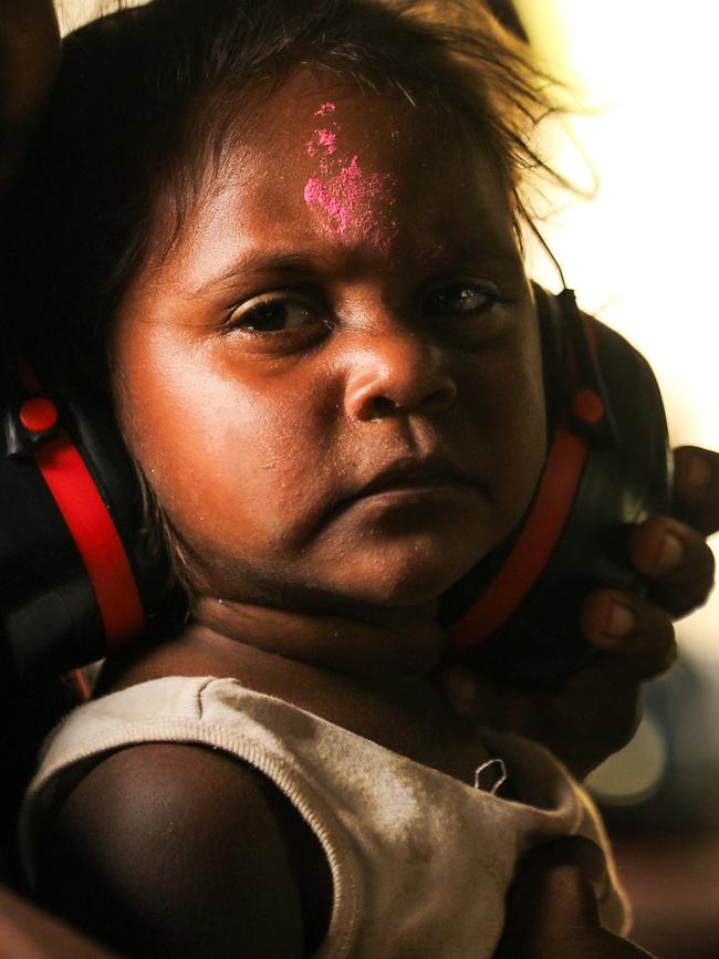 A young child from Wujal Wujal on an Australian Army CH-47F Chinook helicopter from 5th Aviation Regiment, being evacuated on Wednesday. Picture: ADF