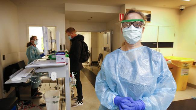 Royal Melbourne Hospital COVID-19 screening clinic ED nurse Robyn Lindsay is on the frontline for testing. Picture: David Caird