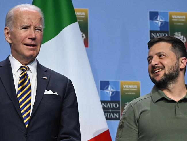 US President Joe Biden (L) and Ukrainian President Volodymyr Zelensky pose during an event with G7 leaders to announce a Joint Declaration of Support for Ukraine during the NATO Summit in Vilnius on July 12, 2023. (Photo by ANDREW CABALLERO-REYNOLDS / AFP)