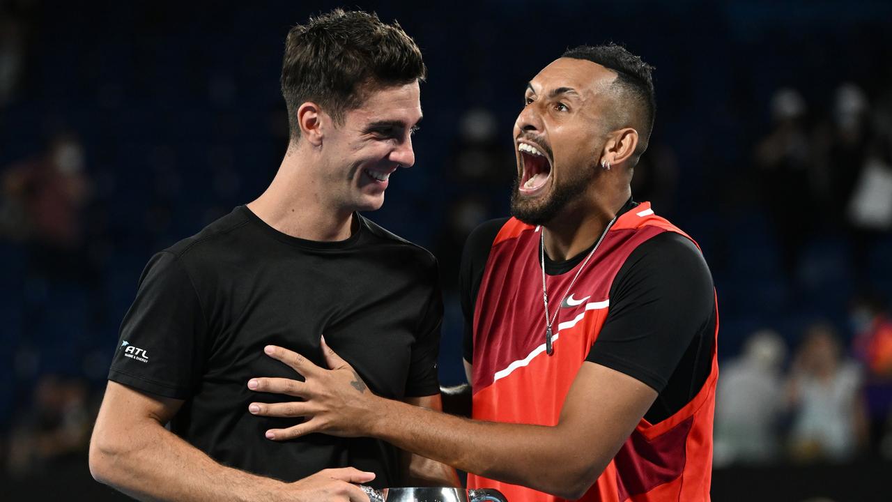 MELBOURNE, AUSTRALIA - JANUARY 29: Thanasi Kokkinakis (L) of Australia and Nick Kyrgios of Australia react after winning their Men's DoublesÃ&#130;Â Final match against Matthew Ebden of Australia and Max Purcell of Australia during day 13 of the 2022 Australian Open at Melbourne Park on January 29, 2022 in Melbourne, Australia. (Photo by Quinn Rooney/Getty Images)