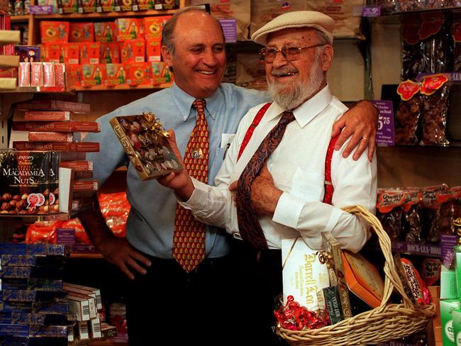 Son of the founder of Darrell Lea confectionery shop, Monty Lea, with his son Jason in their Sydney store during their 70th anniversary celebrations in 1998.