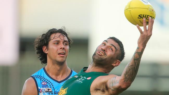 Raphael Clarke takes a one-handed mark against the Darwin Buffaloes. Picture: GLENN CAMPBELL