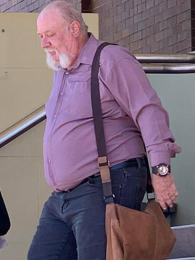 Brian Peter Rogers (right) leaves court after pleading guilty to possessing child exploitation material. Photo: Elyse Wurm