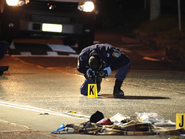 Police at the scene where male later James Polkinghorne was killed.