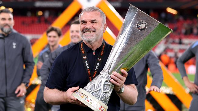 Postecoglou with the spoils of victory after the Europa League triumph. (Photo by Alex Pantling UEFA via Getty Images)
