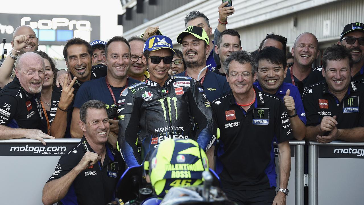 Valentino Rossi celebrates with his crew at the end of the qualifying at Silverstone.